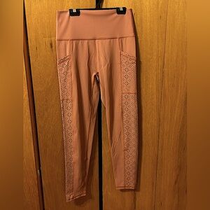Leggings new without tags.  Light burnt orange colour.